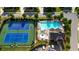 Aerial view of community pool and tennis courts, beautifully landscaped and well-maintained at 3330 Riverwalk Way, Cumming, GA 30040