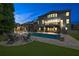 Inviting backyard with a sparkling pool, outdoor seating, and a cozy fire pit area at 3330 Riverwalk Way, Cumming, GA 30040