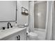 Bathroom with shower featuring gray tile, and sink with black fixtures at 3330 Riverwalk Way, Cumming, GA 30040