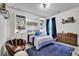 Charming bedroom features custom built-ins, accent wall, and ample natural light at 3330 Riverwalk Way, Cumming, GA 30040