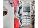 Organized walk-in closet with ample hanging space, shelving, and drawer storage at 3330 Riverwalk Way, Cumming, GA 30040