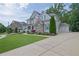 Beautiful two-story home featuring stone and siding accents with a well-manicured lawn at 3330 Riverwalk Way, Cumming, GA 30040