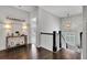 Upstairs foyer area with decorative lighting and hardwood floors at 3330 Riverwalk Way, Cumming, GA 30040