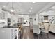 Open concept kitchen, island, and dining area provide seamless living and entertaining at 3330 Riverwalk Way, Cumming, GA 30040