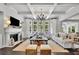 Bright living room features coffered ceiling, fireplace, and abundant natural light through large windows at 3330 Riverwalk Way, Cumming, GA 30040