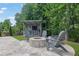 Outdoor bar and fire pit area with seating, ideal for entertaining at 3330 Riverwalk Way, Cumming, GA 30040