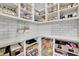 Well-organized pantry with ample shelving, storage containers, and neatly arranged food items at 3330 Riverwalk Way, Cumming, GA 30040