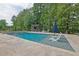 Wide shot of the pool area with a bar and outdoor kitchen area at 3330 Riverwalk Way, Cumming, GA 30040