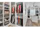 Expansive walk-in closet with custom shelving, hanging rods, and an abundance of storage at 3330 Riverwalk Way, Cumming, GA 30040