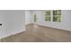 Well-lit basement with durable wood-look flooring and natural light at 4999 Willow Creek Dr, Woodstock, GA 30188