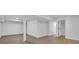 Finished basement featuring durable flooring and neutral paint at 4999 Willow Creek Dr, Woodstock, GA 30188