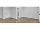 Partially finished basement featuring durable flooring with a bathroom at 4999 Willow Creek Dr, Woodstock, GA 30188