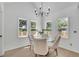 Cozy dining room with hardwood floors, natural light, and seating for four at 4999 Willow Creek Dr, Woodstock, GA 30188