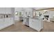 Stylish kitchen boasts an island, stainless appliances, and eat-in dining space at 4999 Willow Creek Dr, Woodstock, GA 30188