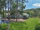 A lovely landscaped lawn and treeline stretch into the distance behind the homes at 1027 Riverbend Club Se Dr, Atlanta, GA 30339