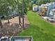 Beautiful green lawn with mature trees and a view of neighboring decks and patios at 1027 Riverbend Club Se Dr, Atlanta, GA 30339