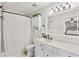 Bright bathroom featuring a shower with a tub, vanity, and modern fixtures at 1027 Riverbend Club Se Dr, Atlanta, GA 30339
