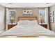 Bright bedroom featuring a plush bed, matching nightstands and natural light at 1027 Riverbend Club Se Dr, Atlanta, GA 30339