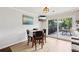 Comfortable dining area with a sliding glass door leading to the deck at 1027 Riverbend Club Se Dr, Atlanta, GA 30339