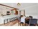 Charming dining area next to the kitchen with breakfast bar and wood beam accents at 1027 Riverbend Club Se Dr, Atlanta, GA 30339