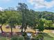 Lush greenery and mature trees surround this beautiful view of the pond at 1027 Riverbend Club Se Dr, Atlanta, GA 30339