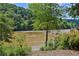 A river view with lush greenery and trees creates a picturesque setting to enjoy being outdoors at 1027 Riverbend Club Se Dr, Atlanta, GA 30339