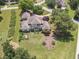 Aerial view of home featuring a well-maintained backyard, complete with a pergola, garden, and lush green lawn at 105 Whippoorwill Way, Fayetteville, GA 30215