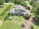 Aerial view of home featuring a well-maintained backyard, complete with a pergola, garden, and lush green lawn at 105 Whippoorwill Way, Fayetteville, GA 30215
