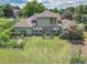 Aerial view of home featuring a well-maintained backyard, complete with a pergola, garden, and lush green lawn at 105 Whippoorwill Way, Fayetteville, GA 30215