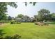 Expansive backyard featuring a well-maintained lawn, mature trees, and lush landscaping for outdoor enjoyment at 105 Whippoorwill Way, Fayetteville, GA 30215