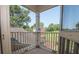 Balcony with a railing, overlooking a neighborhood with green trees and blue skies at 105 Whippoorwill Way, Fayetteville, GA 30215