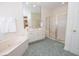 Beautiful bathroom with a corner tub, shower with gold trim, and vanity at 105 Whippoorwill Way, Fayetteville, GA 30215