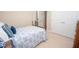 Cozy bedroom featuring carpet flooring, a blue and white bed set, and closet doors at 105 Whippoorwill Way, Fayetteville, GA 30215