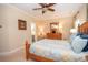 Serene bedroom with wood furniture, ceiling fan, and soft, neutral tones at 105 Whippoorwill Way, Fayetteville, GA 30215