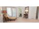 Bedroom with an ensuite bathroom, sitting area, and bright natural light through the windows at 105 Whippoorwill Way, Fayetteville, GA 30215