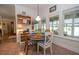Dining area with tile flooring and many windows providing natural light at 105 Whippoorwill Way, Fayetteville, GA 30215