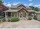Charming home with a spacious front porch, well-manicured landscaping, and an inviting entrance at 105 Whippoorwill Way, Fayetteville, GA 30215