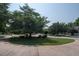Well-maintained front yard with mature trees and manicured lawn on a sunny day at 105 Whippoorwill Way, Fayetteville, GA 30215