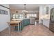 Kitchen featuring an island, stainless steel appliances, and tile flooring at 105 Whippoorwill Way, Fayetteville, GA 30215