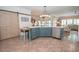 Kitchen showcasing an island with stainless steel appliances and tiled floor at 105 Whippoorwill Way, Fayetteville, GA 30215