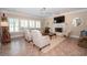 Bright living room featuring a fireplace, ceiling fan, and tile floors at 105 Whippoorwill Way, Fayetteville, GA 30215