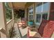 Cozy porch featuring comfortable seating, inviting relaxation with a charming outdoor ambiance and decorative planters at 105 Whippoorwill Way, Fayetteville, GA 30215