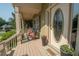 Inviting front porch with seating, decorative elements and a welcoming entrance with a decorative front door at 105 Whippoorwill Way, Fayetteville, GA 30215
