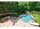 Aerial view of the house, swimming pool, outdoor kitchen and the well-maintained landscaping at 2101 Hunters Green Dr, Lawrenceville, GA 30043