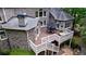 Expansive multi-level deck with outdoor seating and stylish white railings, perfect for entertaining or relaxation at 2101 Hunters Green Dr, Lawrenceville, GA 30043