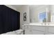 Bathroom features a toilet, shower with curtain, vanity and sink at 2101 Hunters Green Dr, Lawrenceville, GA 30043
