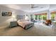 Spacious bedroom with a ceiling fan, plenty of natural light, and neutral paint at 2101 Hunters Green Dr, Lawrenceville, GA 30043