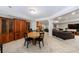 Basement dining area features a round table and chairs, built in cabinets, and tile flooring at 2101 Hunters Green Dr, Lawrenceville, GA 30043