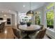 Dining area with wood floors, chair seating and natural light at 2101 Hunters Green Dr, Lawrenceville, GA 30043