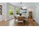Dining area with wood floors, large windows and a round table at 2101 Hunters Green Dr, Lawrenceville, GA 30043